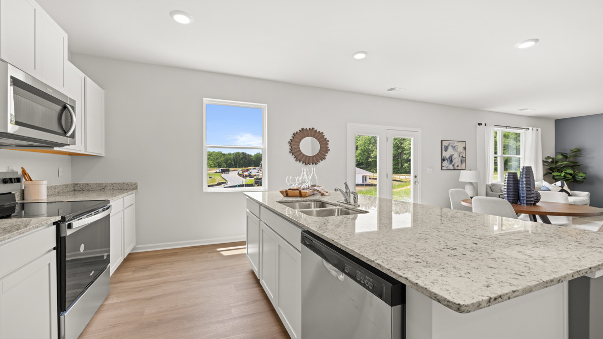 upgraded kitchen with white cabinets
