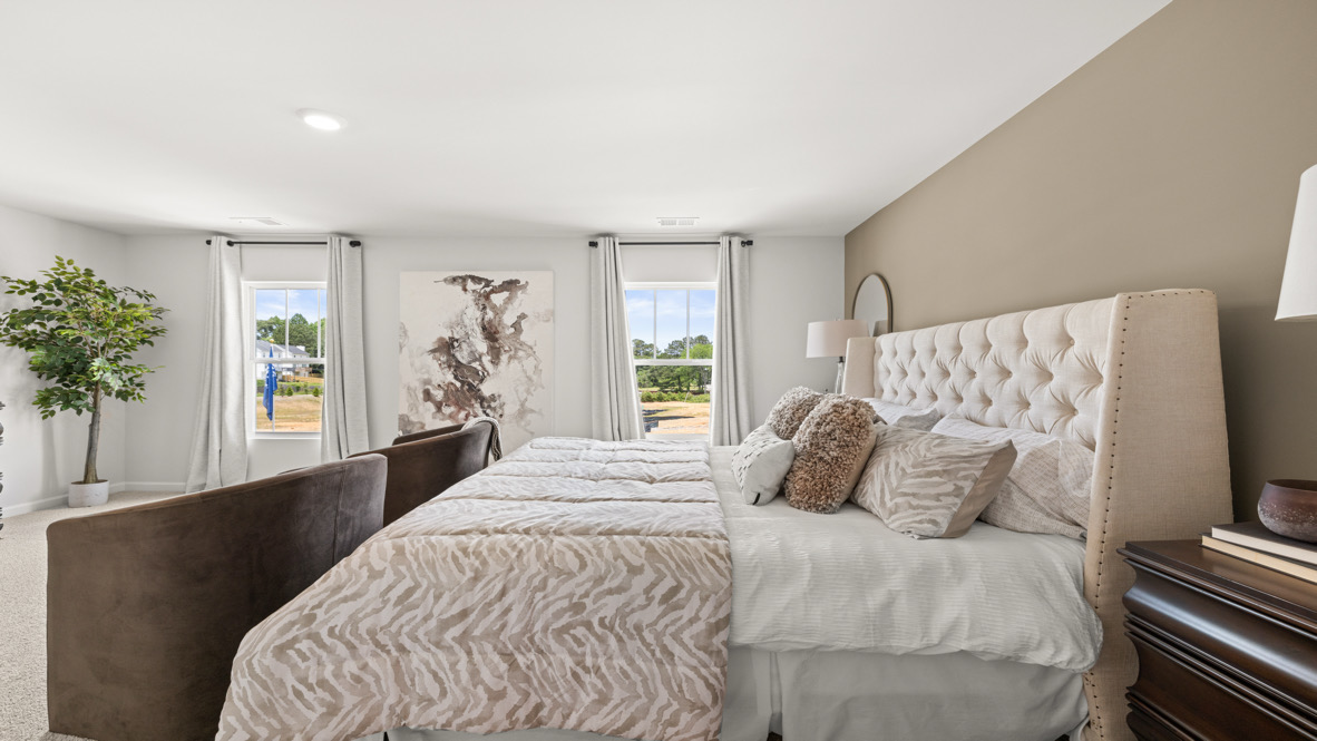 primary bedroom with two large windows Belhaven Plan