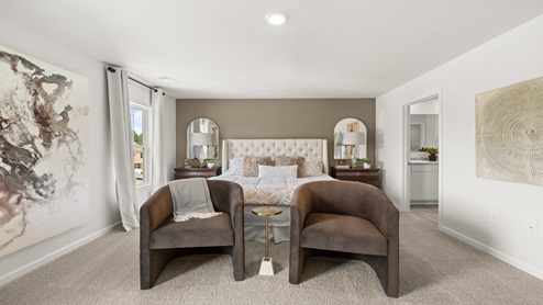 two story model home primary bedroom