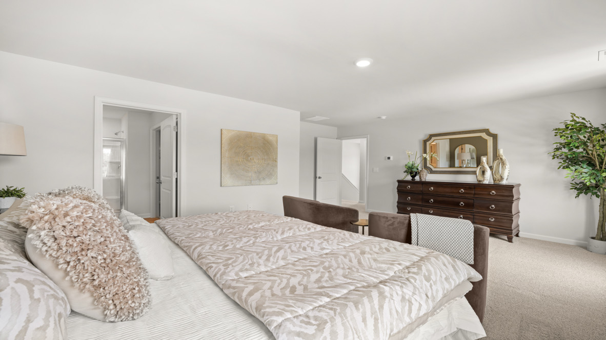 two story model home primary bedroom