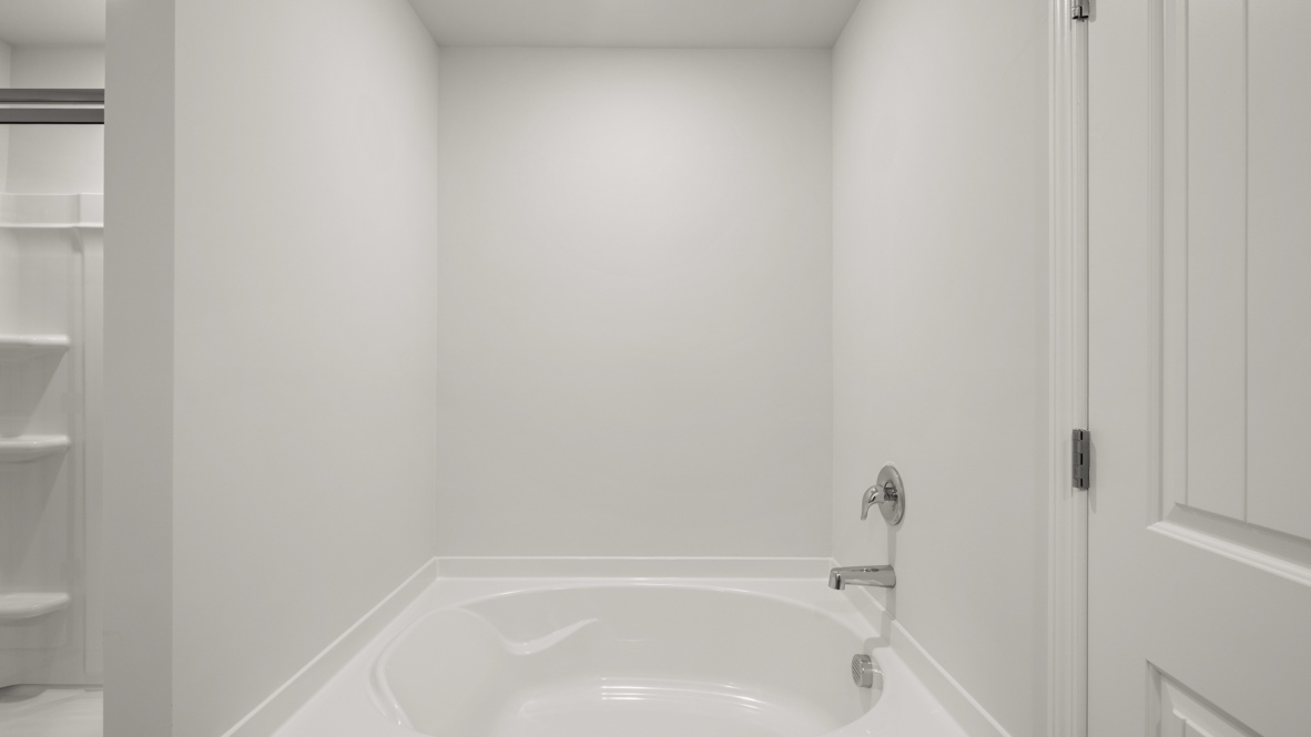 Interior primary bathroom with bath tub