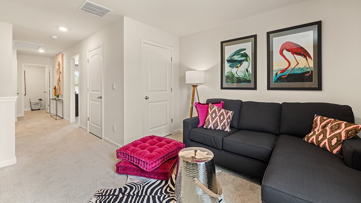 Loft second living area with view of hallway and laundry room.