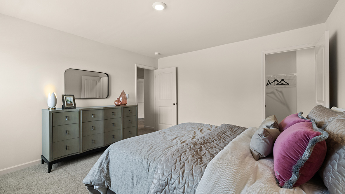 Bedroom, closet, and view of the hallway.