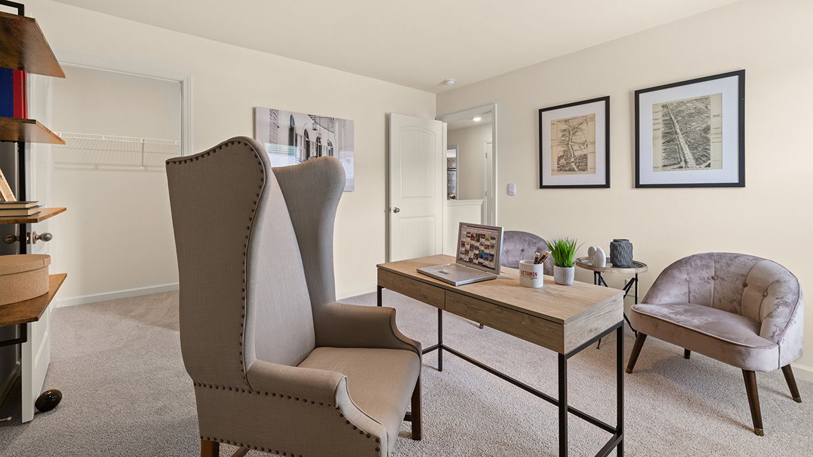Bedroom with a single window and a closet with view of entry to hallway.