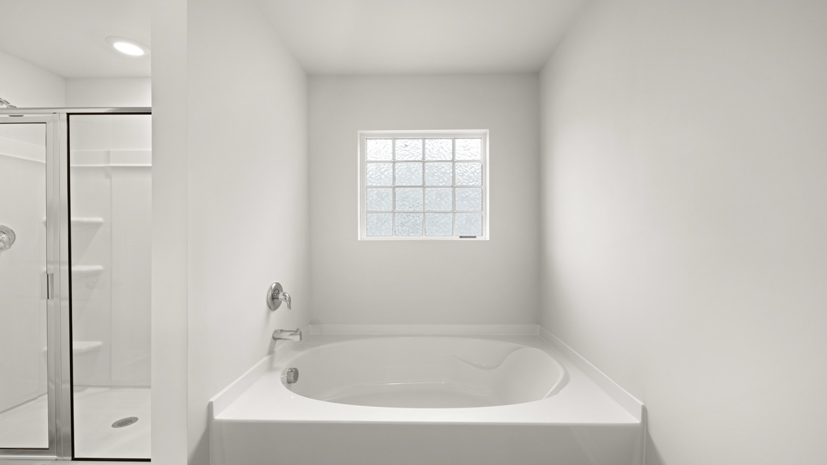 primary bathroom with double vanity sinks.