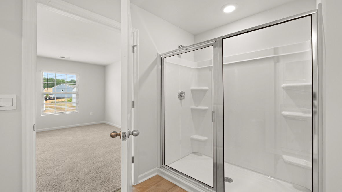 primary bathroom with double vanity sinks.