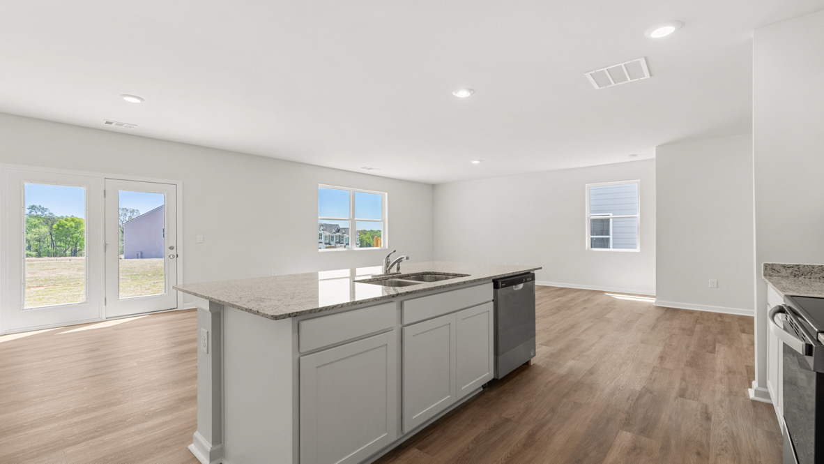 Interior kitchen with center island and open to living area