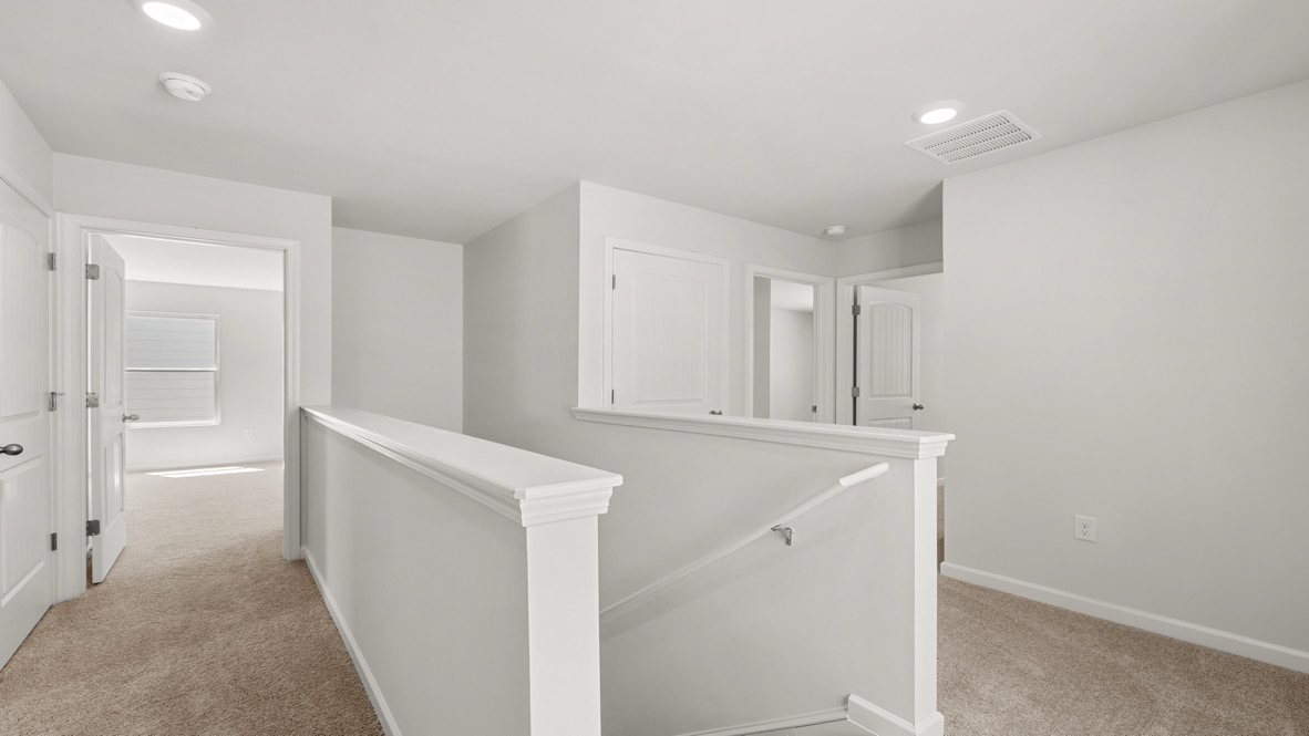 Interior upstairs loft area open to staircase