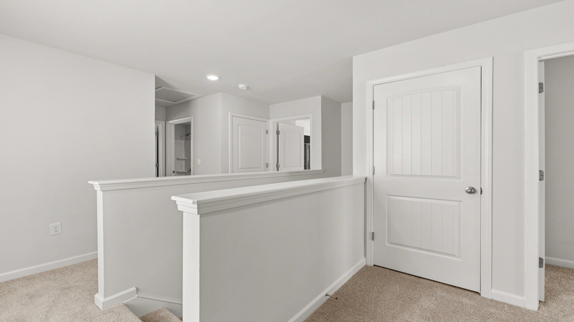 Interior upstairs loft area open to staircase