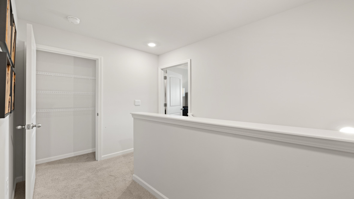 Interior upstairs loft area open to staircase