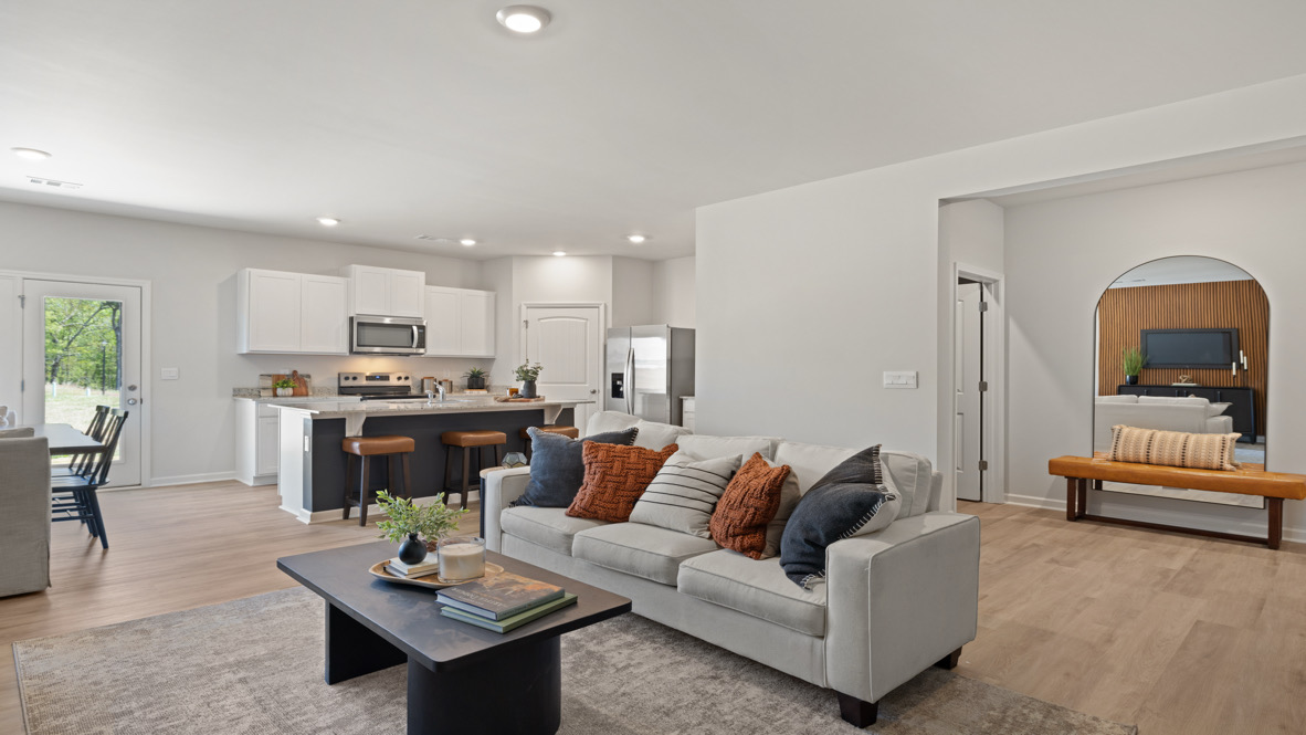 Open Concept living room adjacent to the kitchen with wide sightlines and clean finishes