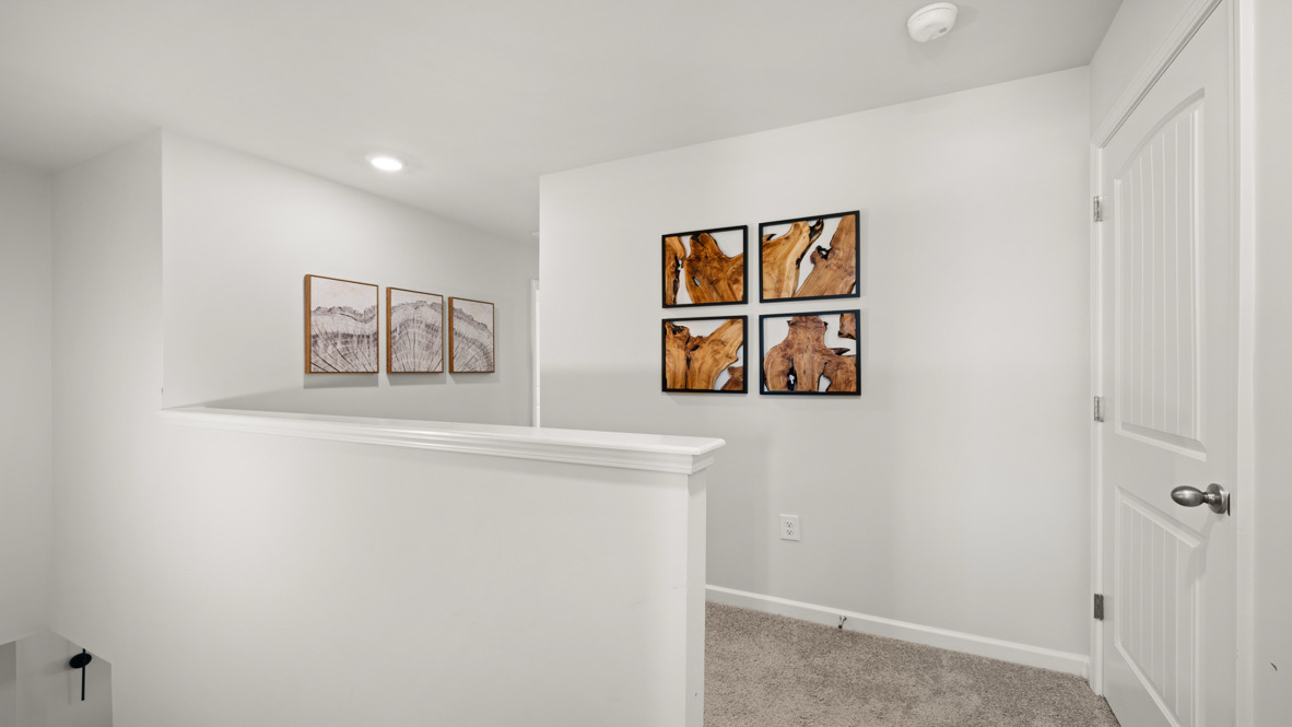 Loft + Secondary Bedroom Modern upstairs configuration features living and sleeping areas for remote work, study, or visitors in this New Townhome