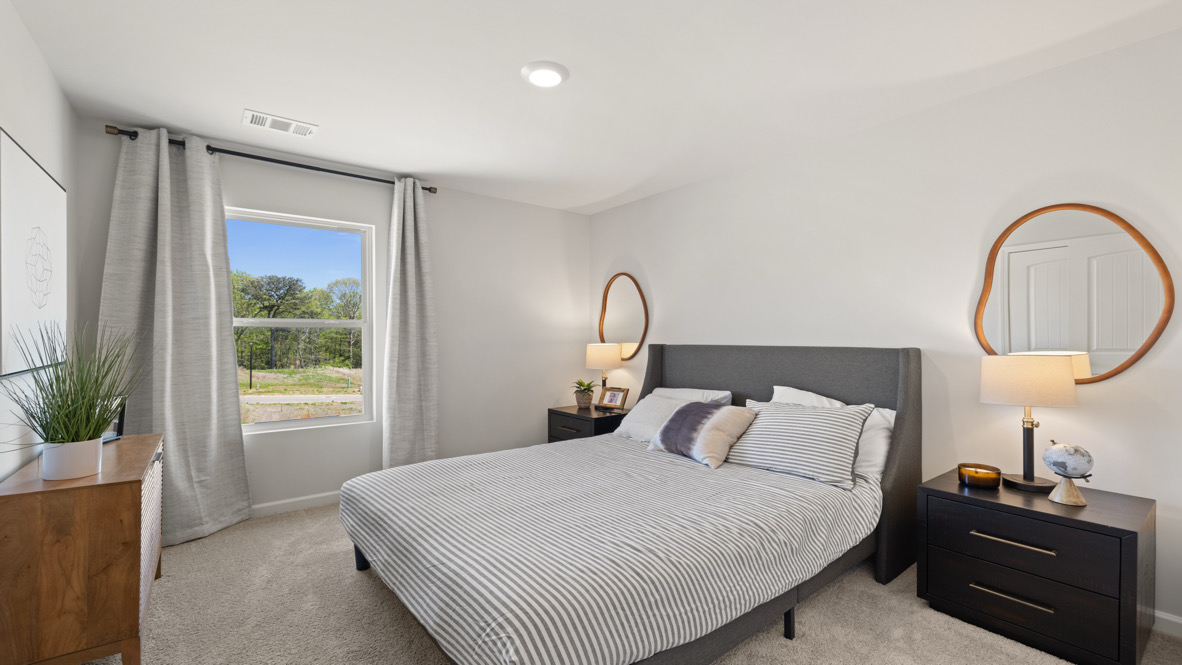 Secondary Bedroom Additional bedroom in this home showcases plush flooring, single door closet, and convenient hallway access