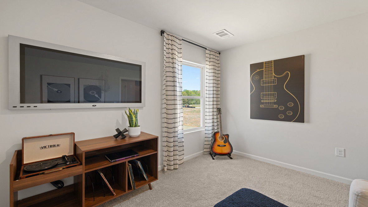 Secondary Bedroom New Townhome bedroom features traditional closet doors, carpeted floors, and spacious wall arrangement for flexible room design