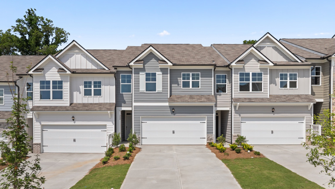 Front exterior of Sudbury Plan townhomes By D.R. Horton, by D.R. Horton in Rolling Meadows Jasper Georgia with modern curb appeal