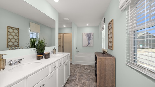 sample galen primary bathroom  with separate tub and shower at palisades in dallas georgia