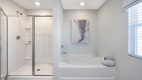 sample galen primary bathroom  with separate tub and shower at palisades in dallas georgia