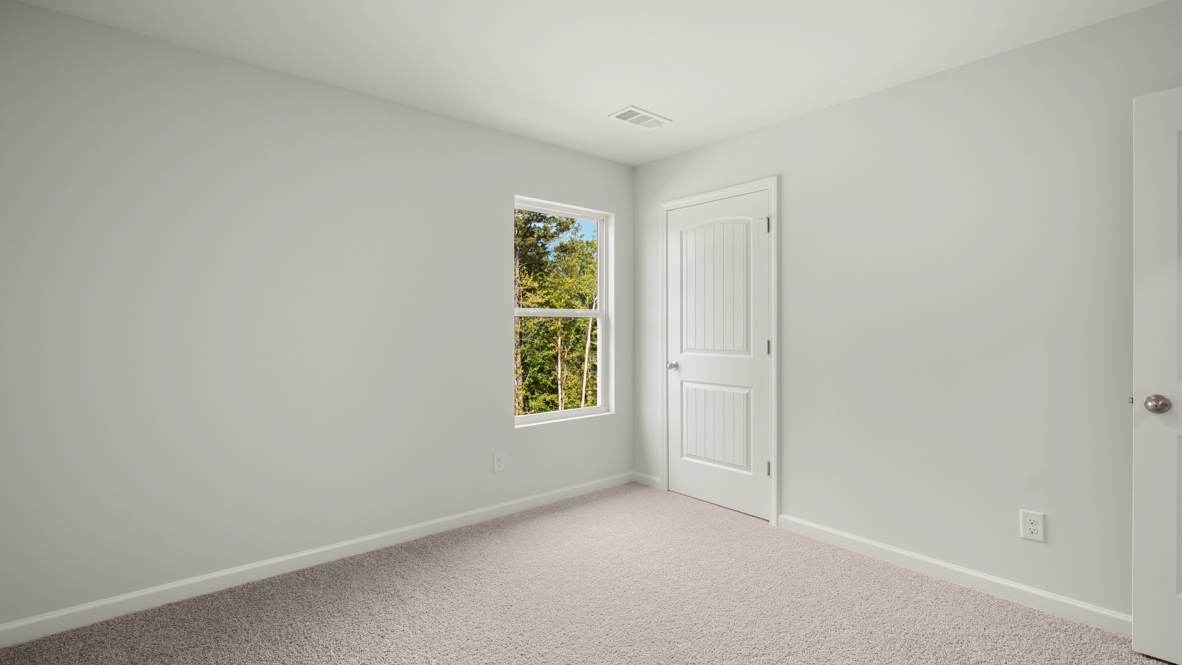 Interior bedroom with window and closet