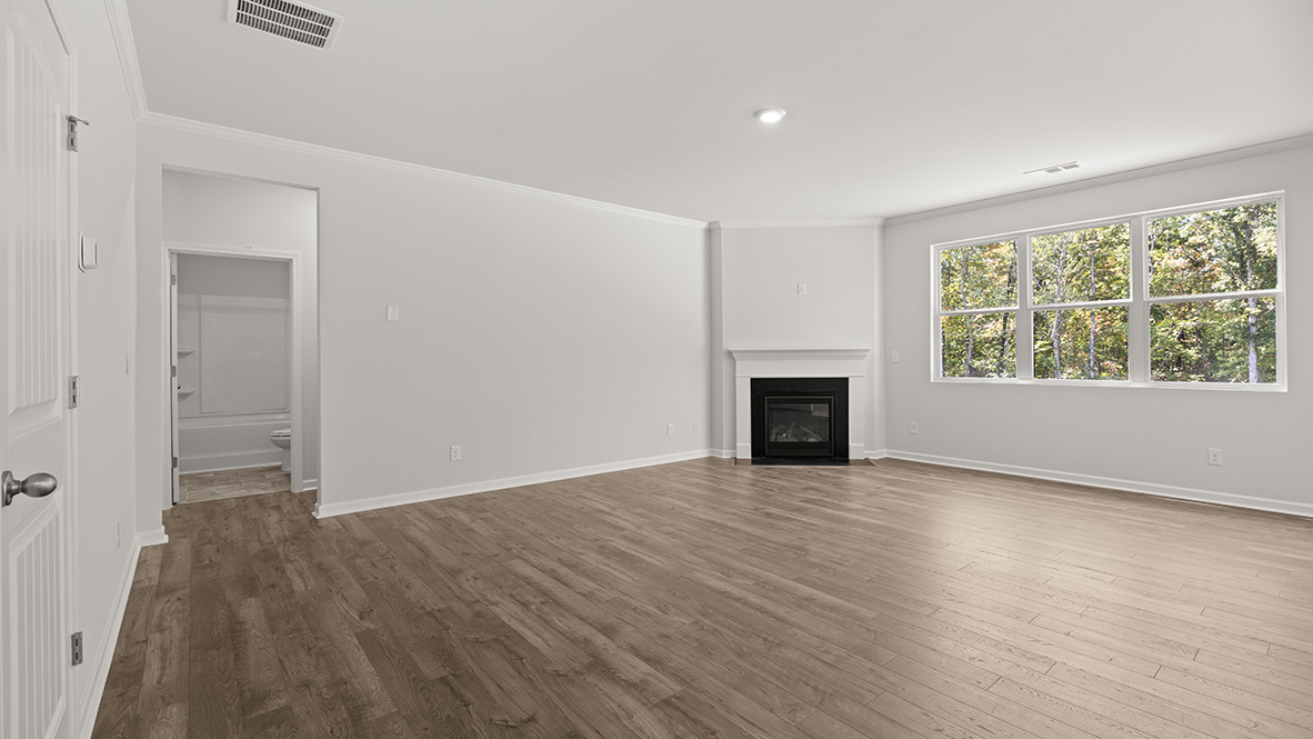Interior living area with fire place and large windows