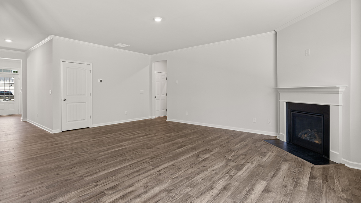 Interior living area with fire place and large windows