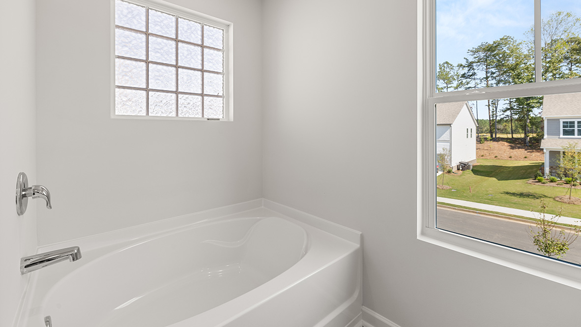 Interior primary bathroom with bath tub