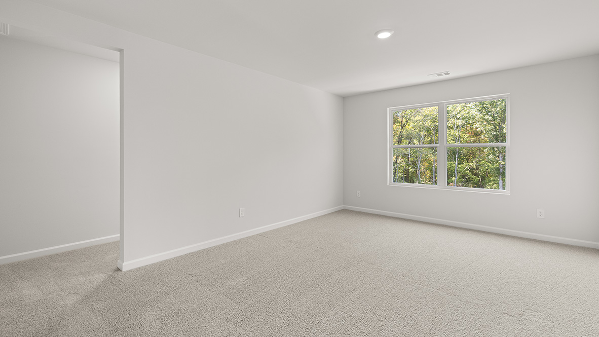 Interior upstairs loft area with large window