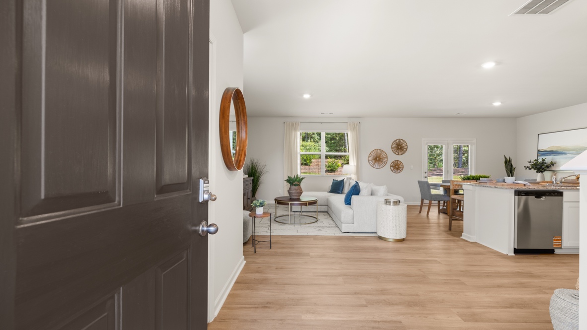 Interior entry-way leading to living area and kitchen