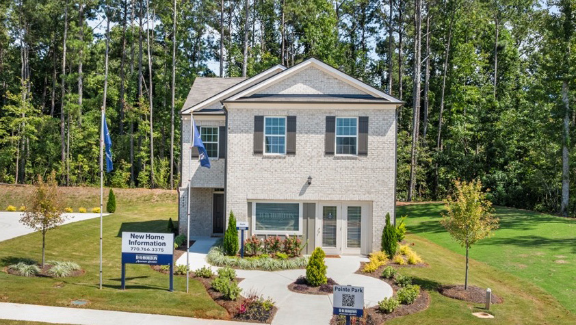 Interior entry-way open to staircase and leading to living area