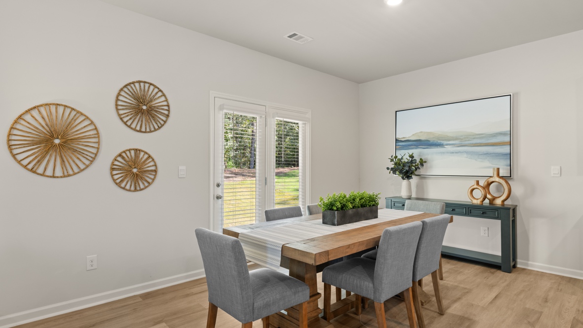 Interior dining area next to back patio doors