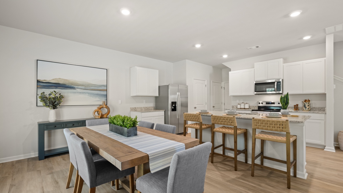 Interior dining area open to kitchen with center island