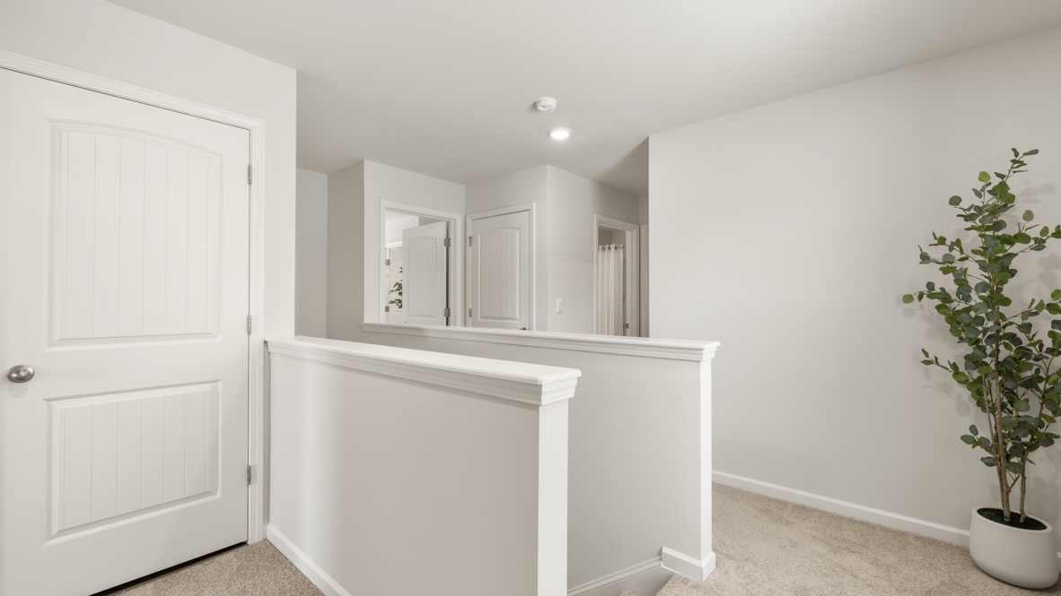 Interior upstairs loft area open to staircase