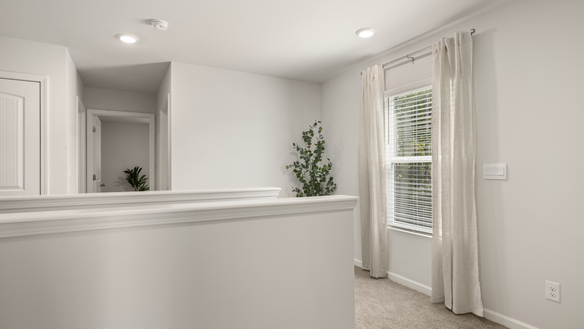 Interior upstairs loft area open to staircase