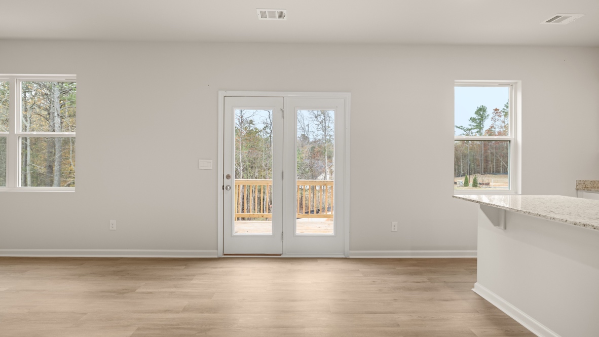 Interior living area with large windows and back patio doors