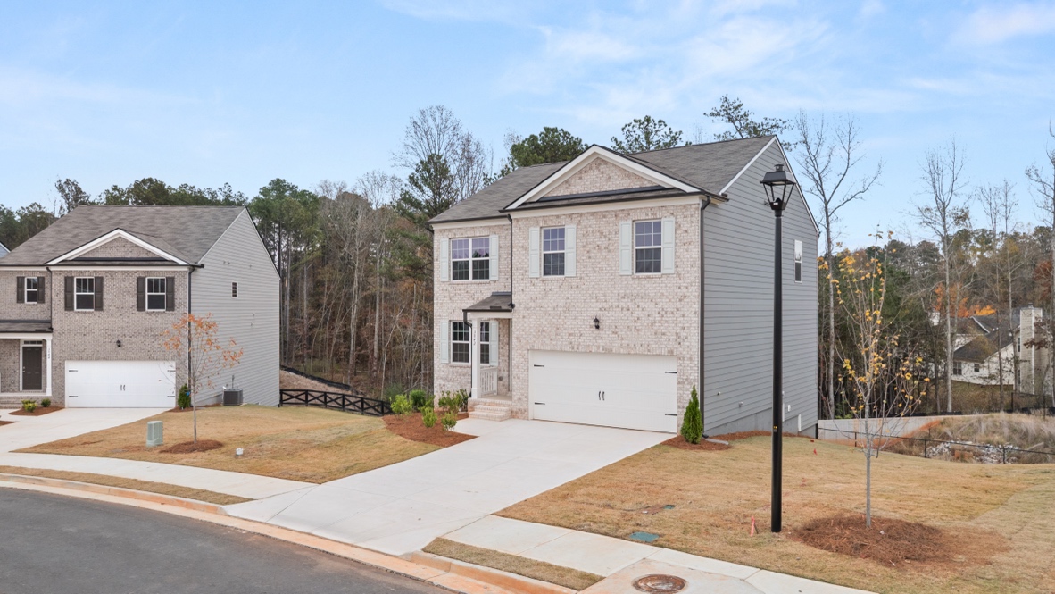 Exterior two-story home with stone detailing