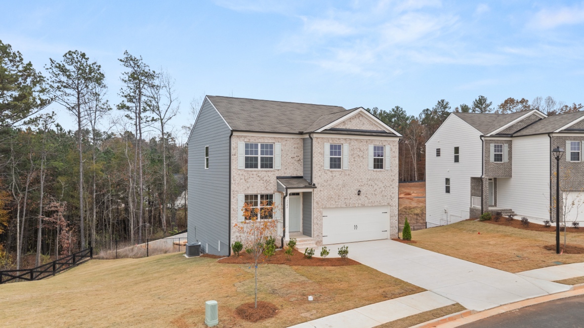 Exterior two-story home with stone detailing
