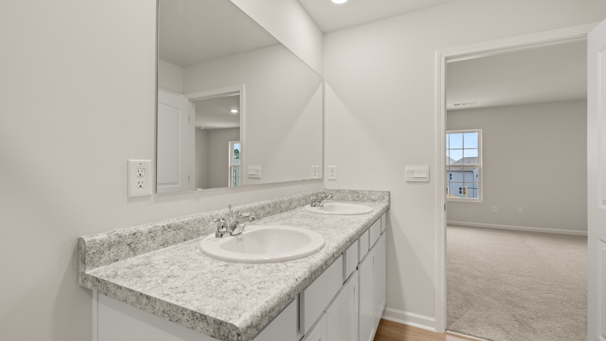 Interior primary bathroom with double sink