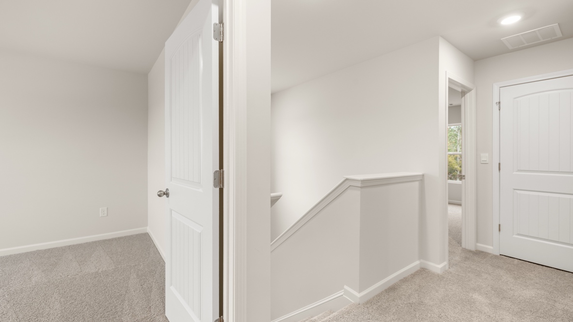 Interior upstairs loft area open to staircase