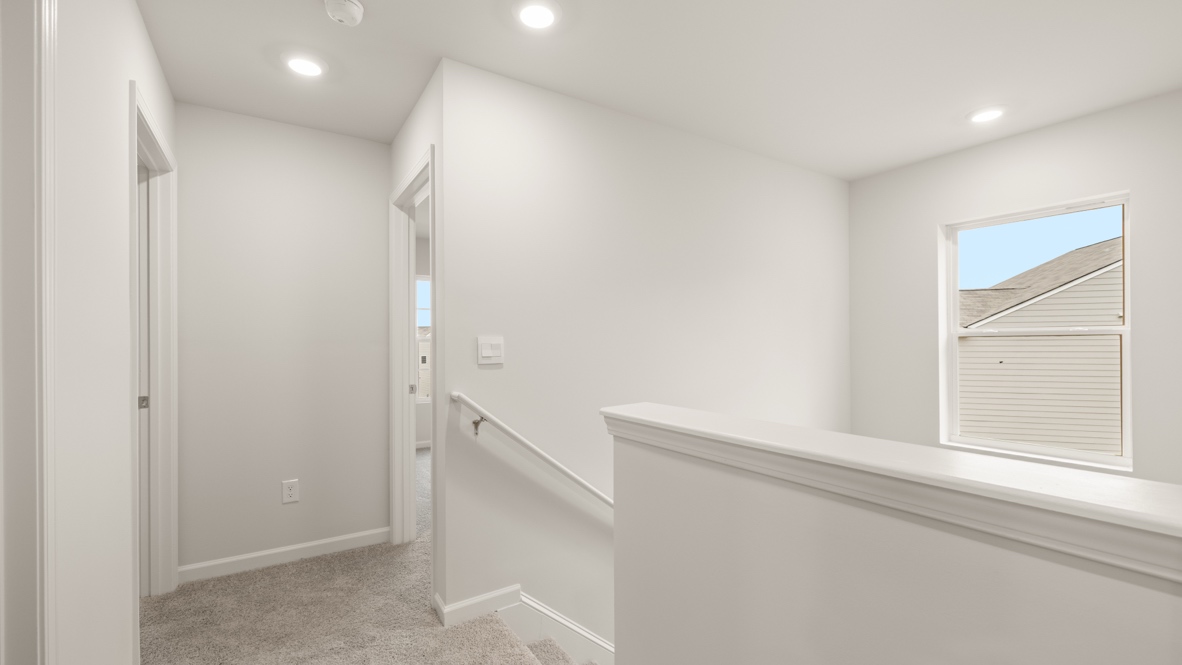 Interior upstairs loft area open to staircase