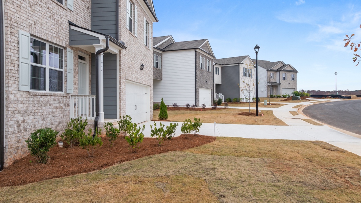 Exterior two-story homes with stone detailing