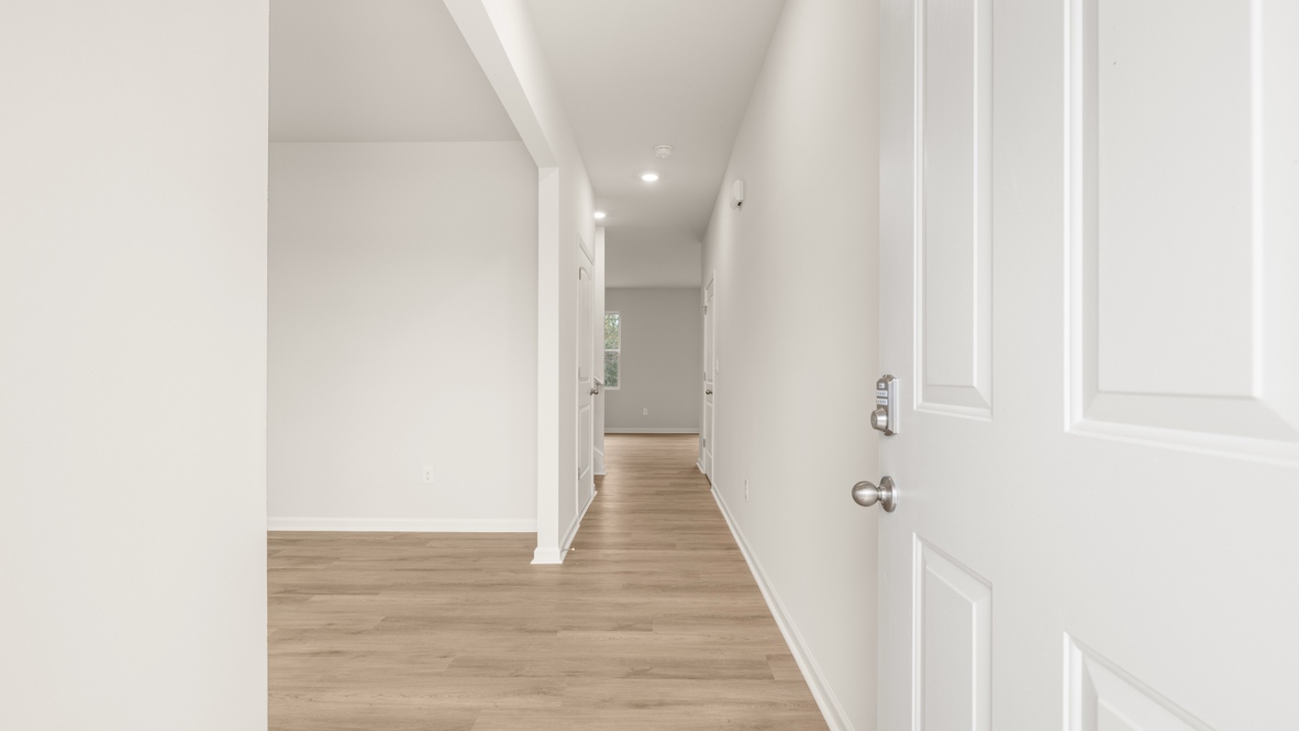 Interior entry-way next to flex room and open to living area