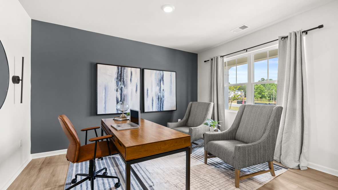 Interior flex room with accent wall and large window