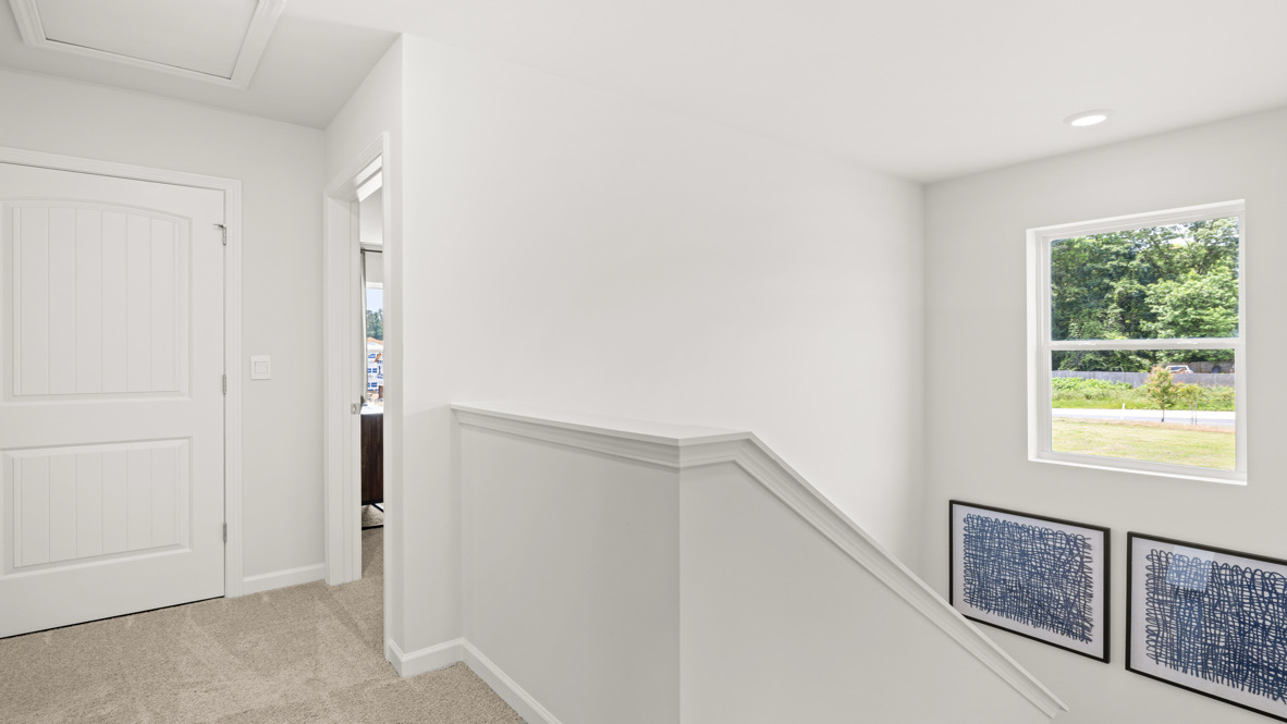 Interior upstairs loft area open to staircase