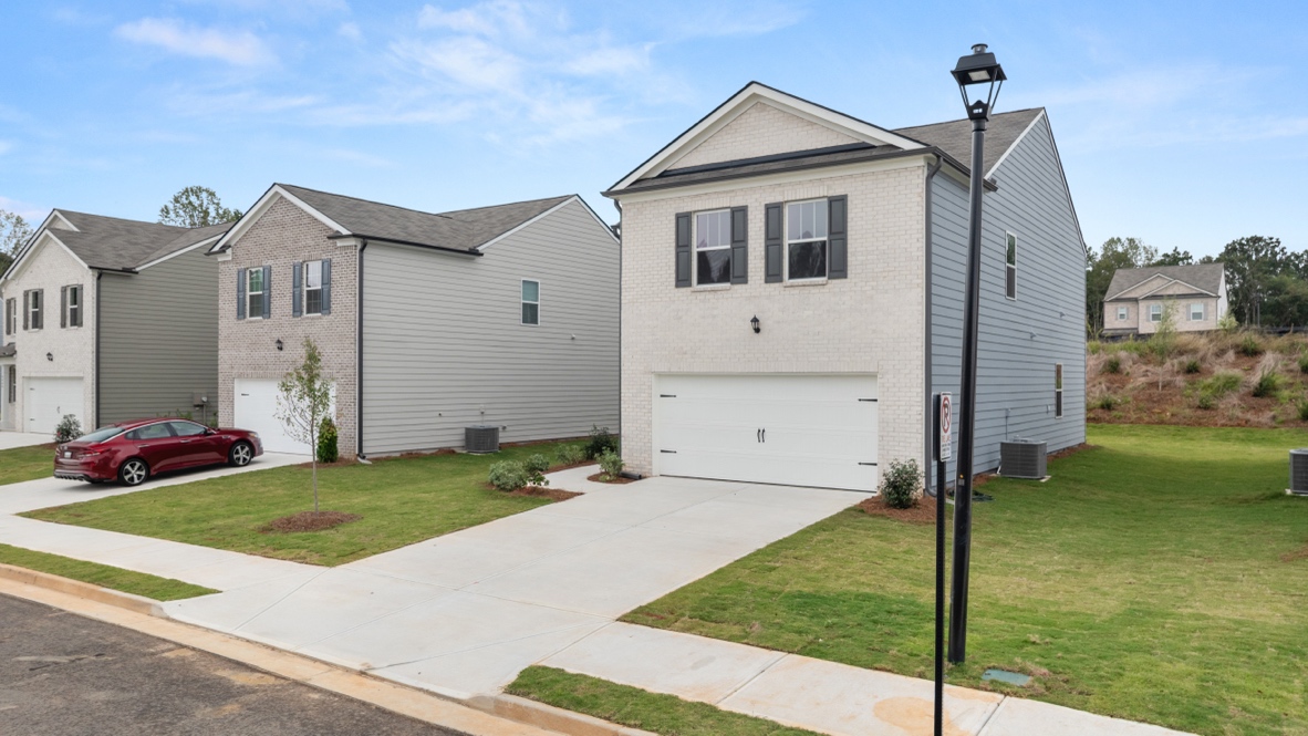 Exterior two-story home with stone detailing