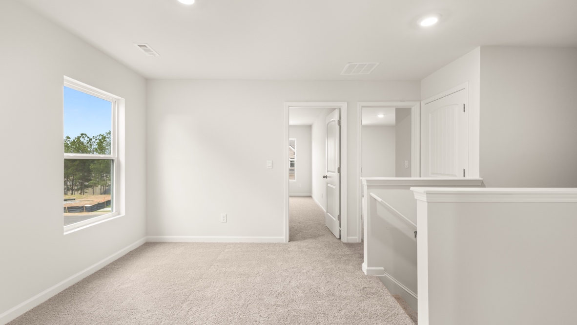 Interior upstairs loft area open to staircase