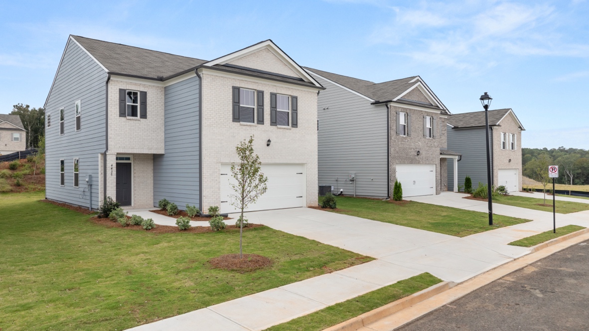 Exterior two-story home with stone detailing