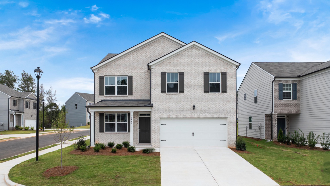 Exterior two-story home with stone detailing