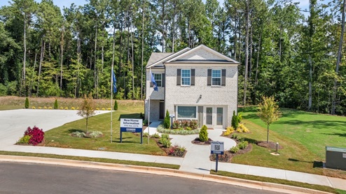 Exterior two-story home with stone detailing