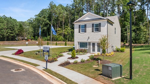 Exterior two-story home with stone detailing