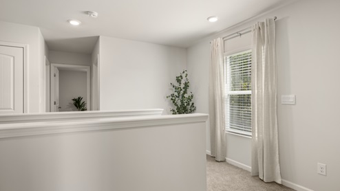 Interior upstairs loft area open to staircase