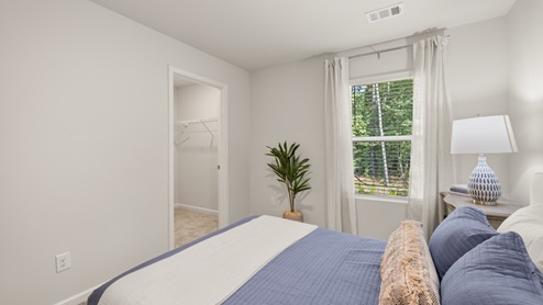 Interior bedroom with window and closet